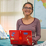 Photo of student using laptop in Residence Hall room