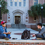 Photo of FSU students sitting outside of Landis Hall