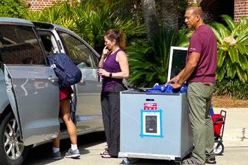 Photo of people unloading van